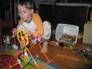 Marcus Building a Ferris Wheel from K'Nex
